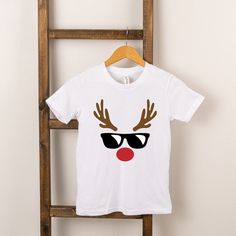 Looking for a cute tee for your kids? We have the perfect Reindeer Boy graphic tee addition to their closet! Kids Christmas Shirts Vinyl, Kids Christmas Tee Shirts, Kids Christmas Shirts Vinyl Boy, Reindeer Tshirts, Christmas Shirts Vinyl, Reindeer Shirt Target, Kids Chrismtas Shirt, Holiday Graphic Tees, Christmas Shirts For Kids