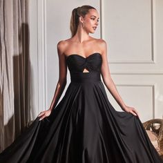 The Charming Dress Made Of Delicate Satin Has A Natural Shine, The Which Will Create An Eye-Catching Image, While The Ruched Bodice Will Emphasize Your Figure And An Inconspicuous Zipper On The Back Will Ensure A Reliable Fixation Of The Dress. Fabric: Satin Length: Long Color: Black Neckline: Off Shoulder Silhouette: A-Line Sleeve: Sleeveless Back: Zipper Embellishments: Ruched Bodice Occasion: Romantic Date/Evening/Dinner, Wedding/Bridesmaid, Graduation, Fashion Show, Visiting Theater/Museum/R Black Prom Dress With Boned Bodice, Black Sleeveless Dress With Boned Bodice, Evening Sleeveless Dress With Ruched Fitted Bodice, Sleeveless Ruched Gown For Evening Dress, Black Strapless Dress With Boned Bodice For Evening, Black Ruched Bodice Maxi Dress For Gala, Sleeveless Ruched Gown For Evening, Sleeveless Ruched Evening Gown, Black Strapless Dress With Ruched Bodice For Evening