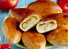 several pieces of bread on a plate with an apple in the background