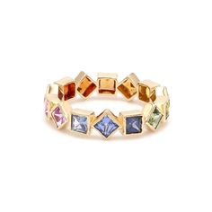 a gold ring with multicolored stones on the inside and outside, set against a white background