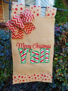 a burlocked christmas banner hanging on a fence