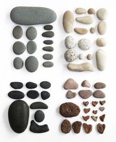 various rocks and pebbles arranged on a white surface