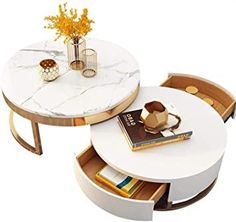 a marble topped table with two chairs and a book shelf underneath it, next to a vase filled with yellow flowers