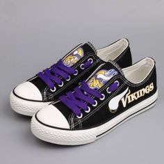 a pair of black and purple sneakers with the word minnesota on them