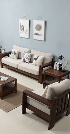 a living room filled with furniture and blue walls