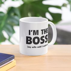 a coffee mug that says i'm the boss my wife said i could't