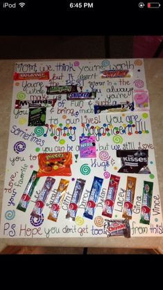 a table covered in candy and writing on it