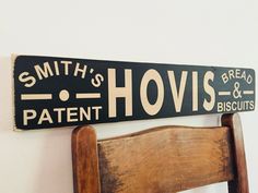 a black and white sign that says, smith's hovis bread biscuits