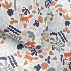 an orange and blue fabric with animals on it