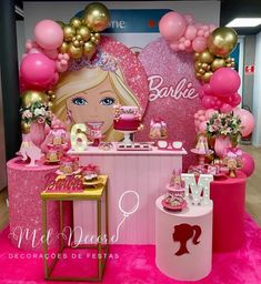 a barbie birthday party with pink and gold decorations