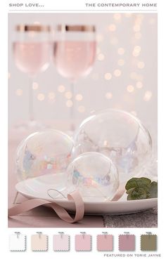 a plate with two bubbles and some pink wine glasses on it, next to the words shop love