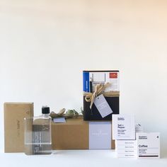 an assortment of items are displayed on a white surface with boxes and tags around them