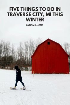 a person on skis in front of a red barn with the words five things to do in traverse city, mt this winter