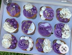 there are twelve cupcakes with purple frosting and white icing on them