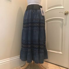 Nwt Lapis Maxi Skirt Is A Tiered Denim Style , With Built In Tie Front Belt Design, Elastic Back,And Beautiful Embroidered Details. New With Tag . See Close Up Photos For Colors And Details. Casual Blue Denim Skirt With Elastic Waistband, Blue Non-stretch Mid-rise Skirt, Non-stretch Mid-rise Blue Skirt, Casual Blue Long Denim Skirt, Bohemian High Waist Dark Wash Bottoms, Bohemian High-rise Fitted Bottoms, Bohemian High Rise Fitted Bottoms, Bohemian Dark Wash High Waist Bottoms, Medium Wash Tiered Denim Skirt