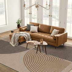 a living room with a couch, coffee table and rug