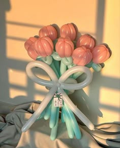 a bunch of balloons in the shape of flowers