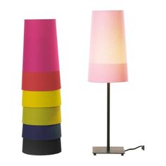 a lamp that is next to a multicolored lamp on a white background,