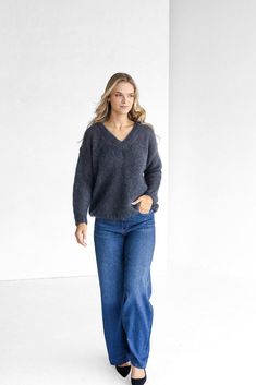 This gray cable-knit oversized pullover is a perfect blend of luxury and sustainability. Made from pure mohair and silk yarns, it offers a soft, fluffy texture that's both eco-friendly and elegant. The deep V-neck and chunky knit design create a relaxed, stylish fit, making it ideal for fall layering.  EVERY KNITTED ITEM HAS A STORY, PEOPLE, AND TRADITIONS BEHIND IT DETAILS - Our creations come to life in a Lithuanian artisan workshop, within small family-run businesses. The artisans infuse thei Artisan Workshop, Oversize Pullover, Story People, Oversize Women, Fall Layers, Sweater Grey, Mohair Wool, Oversized Pullover, Pullover Sweater Women