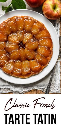 an apple tarte on a white plate with apples in the background and text that reads classic french tarte