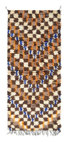 a brown and blue rug with fringes on the bottom, in an abstract pattern