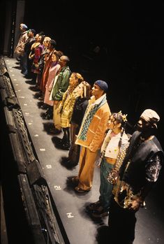 a group of people standing on top of a stage