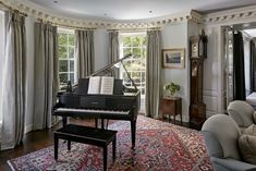 a grand piano in the corner of a living room