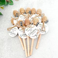 a bunch of wooden picks with name tags on them