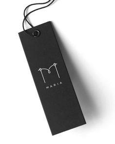 a black tag with the word marina on it