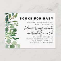 the book request for baby is displayed on a marble surface with white and green leaves