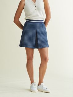 The Rita Skort utilizes this collection's comfort fabric in an A-Line front pleat skort. Pockets and a thin comfort shortie provide a sportier look. A 17" length and higher waist ensures that polished A. PUTNAM style.A Note From Ali: Excited to bring this fabric to life in a golf skort, adorned with a stripe waist band to make this extremely comfortable. We love the changeup to a thinner stretch shortie that is not as compressing as traditional spandex. This one balances the line of sporty and s Skort Dress, Dress Blues, Polo Shirt Dress, Cashmere Hoodie, Cashmere Dress, Golf Apparel, Golf Skort, Ralph Lauren Outfits, Athletic Performance