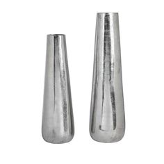 two silver vases sitting next to each other on a white surface with no one in it