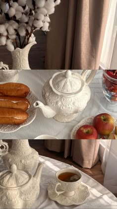 a table topped with white dishes filled with fruit and pastries next to a vase full of cotton floss