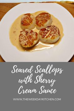 four scallops with creamy cream sauce on a white plate and text overlay reads, seared scallops with cherry cream sauce