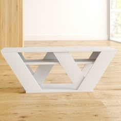 a white shelf sitting on top of a hard wood floor