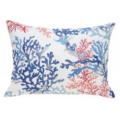 a blue and red pillow with corals on it