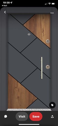 a modern door with wood paneling and metal handles