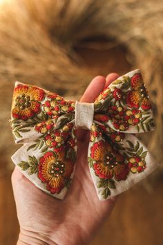 Add a touch of autumn charm to your hair with this exquisite linen hair bow in fall colors. Featuring intricate floral embroidery and delicate beads, this hair accessory will elevate any outfit with its unique and elegant design. Perfect for adding a pop of color and texture to your look, this hair bow is a must-have for any fashion-forward individual. Handcrafted with care and attention to detail, this piece is sure to become a favorite in your accessory collection. The size of this embroidered hair bow is approximately 5 '' x 4'' (13 cm x 8 cm). The hair bow is attached to alligator hair clip, which is very easy to put on any hairstyles. The bow will be packed in a nice eco friendly packaging and will be sent with the tracking number of the parcel. Delivery usually takes about 14 days. I Embroidered Hair Clips, Embroidery And Beads, Embroidered Hair Bows, Clothes Embroidery, Clothes Embroidery Diy, Embroidery On Clothes, Handmade Hair Accessories, Beads Handmade, Girls Bows