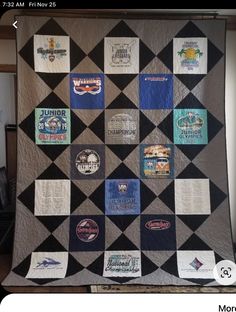 a quilt made with various beer labels on the front and back, hanging from a wall