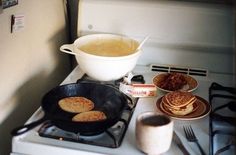 pancakes are being cooked on the stove top