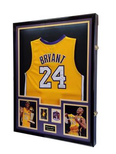 a basketball jersey is displayed in a shadow box with multiple photos and an award plaque