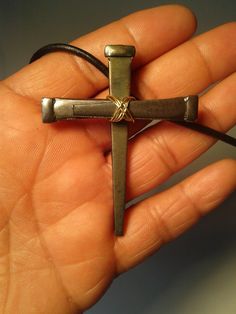 This crucifix pendant made of three steel nails serves as a visual reminder of Christ's ultimate sacrifice for mankind, and a proud statement of faith. Nail cross is approximately 2.5 inches long, 2 inches wide; total necklace length is approximately 14 inches. Handmade clasp, wire wrap bail and findings. Wire is silverplated copper with a flexible nylon coating. Because these are handmade, each cross pendant may vary slightly from the picture shown.  A wonderful gift for Easter, baptisms, First Communion, or Confirmation. Adjustable Metal Cross Necklace, Crucifix Metal Jewelry, Metal Crucifix Necklace As Gift, Wire Wrapped Crucifix Necklace For Gift, Metal Crucifix Cross Necklace Gift, Nail Cross Necklace, Nail Cross, Wire Crosses, Steel Nails