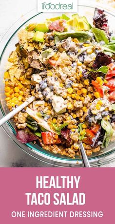 a healthy taco salad in a glass bowl with the words healthy taco salad on it