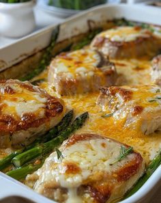 a casserole dish with chicken and asparagus