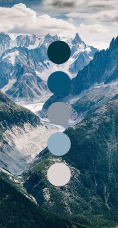 the mountains are covered in snow and blue circles