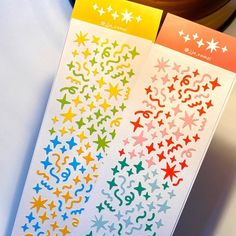 two different colored stars stickers on top of each other