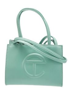 Telfar ToteGreen Vegan LeatherSilver-Tone HardwareFlat Handles & Dual Shoulder StrapsTwill LiningSnap Closure at TopIncludes Dust Bag Forest Green Telfar Bag, Professional Pictures, Shopper Tote, Shopping Tote, Cross Body Handbags, Gym Bag, Women Handbags, Dust Bag, Top Handle Bag