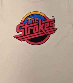 the strokes logo on a white t - shirt