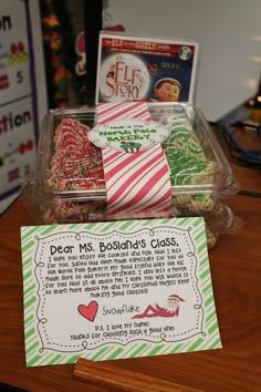 a box with some candy on it and a sign that says dear ms bosdad's class