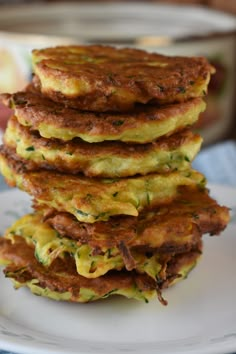 a stack of food sitting on top of a white plate